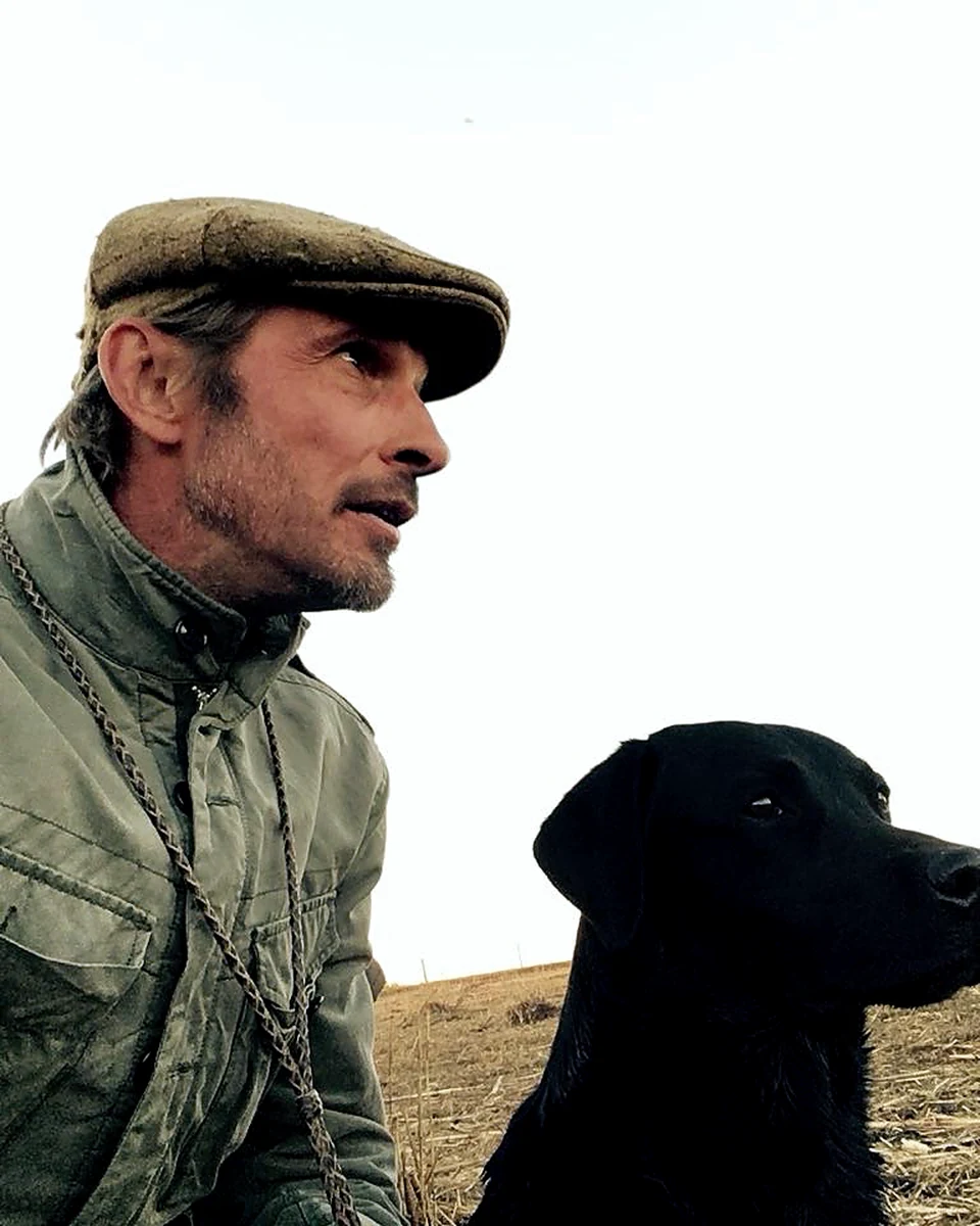 Gareth with Jack, the dog and the property in the background