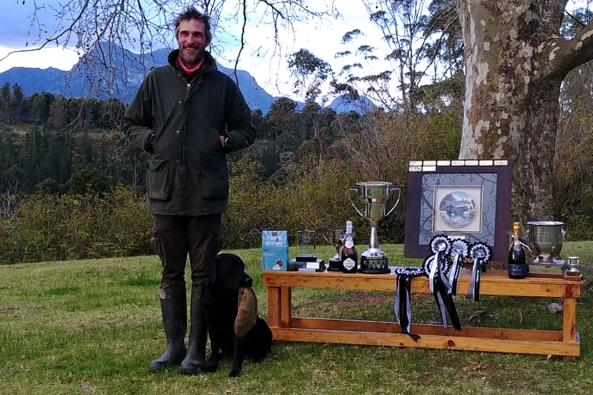 Gareth with dogs and the trophy display